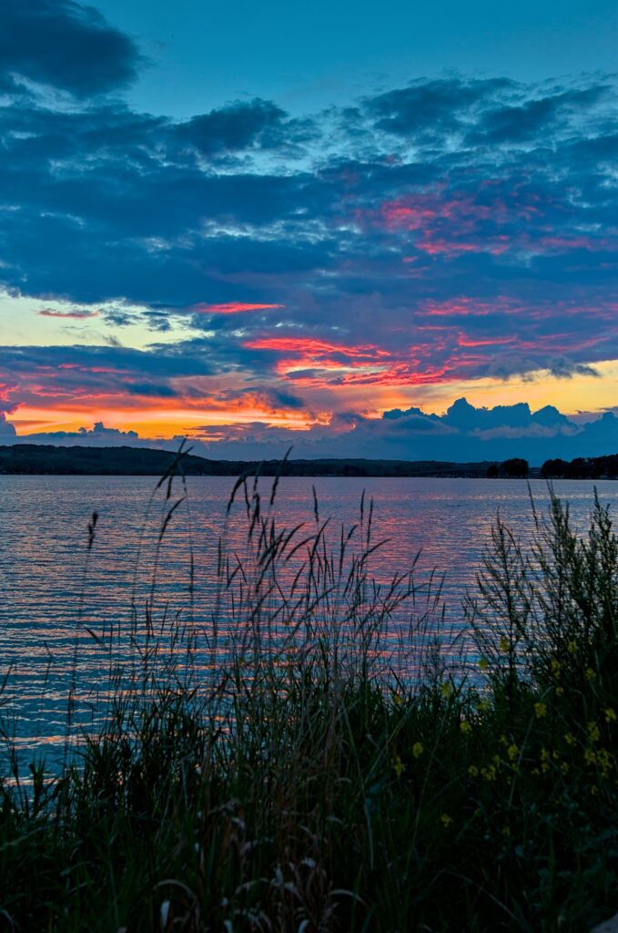 Photograph of a beautiful sunset over Chautauqua Lake in New York.